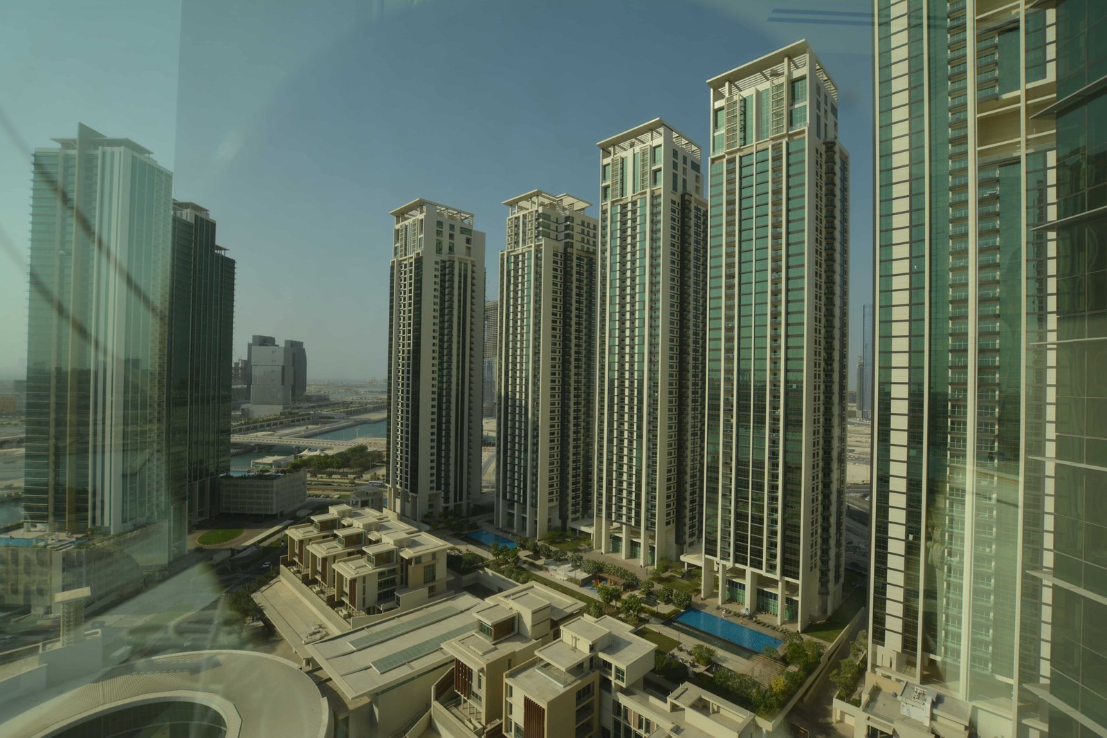 Panoramic view of Abu Dhabi skyline from Ocean Terrace Tower balconies, highlighting luxury waterfront living and Marina Square surroundings.