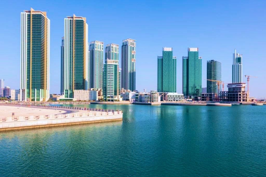 Al Durrah Tower Al Reem Island waterfront elevation with glass exterior reflecting city skyline views.